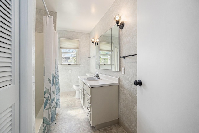 615 Garber Rd, North Muskegon, MI 49445 - full bathroom featuring vanity, toilet, and a shower with shower curtain