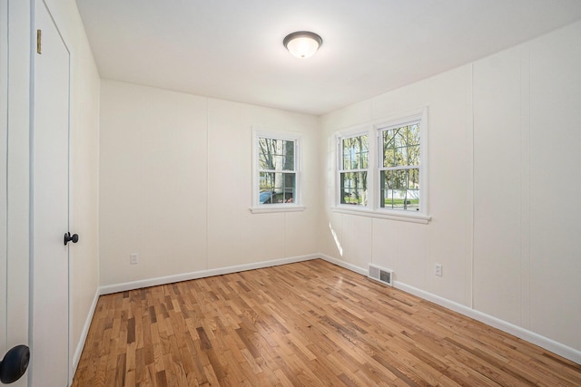 615 Garber Rd, North Muskegon, MI 49445 - empty room with light wood-style flooring and baseboards