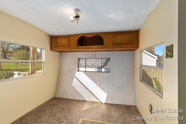 771 Sunny Trl, Greenville, MI 48838 - spare room featuring stone finish floors