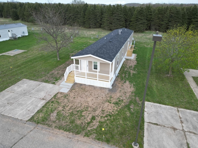 20803 Grandville Rd Unit 213, Big Rapids, MI 49307 - view from above of property with a heavily wooded area