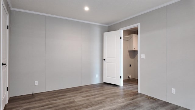 20803 Grandville Rd Unit 213, Big Rapids, MI 49307 - unfurnished bedroom featuring wood finished floors, crown molding, and recessed lighting