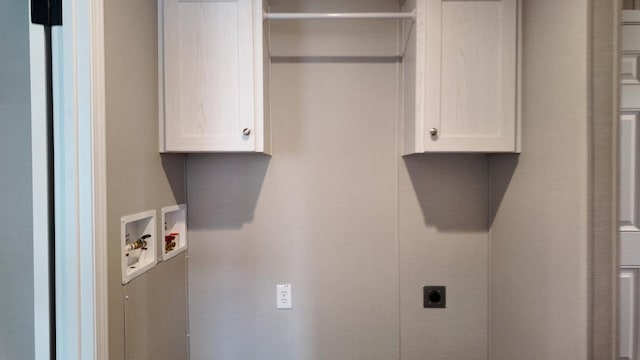20803 Grandville Rd Unit 213, Big Rapids, MI 49307 - laundry area featuring cabinet space, washer hookup, and hookup for an electric dryer