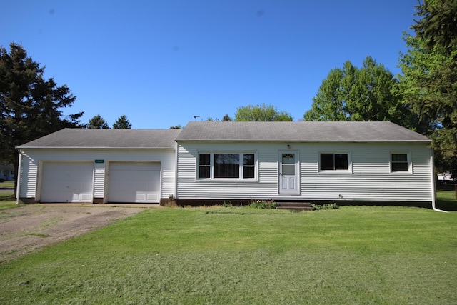 13687 W Tremblay Dr, Vicksburg, MI 49097 - ranch-style house with a front yard, dirt driveway, and a garage