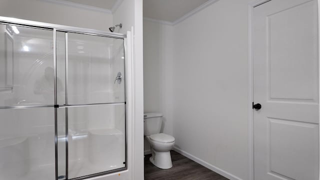20728 Kalamazoo Rd, Big Rapids, MI 49307 - full bathroom with crown molding, a shower stall, wood finished floors, toilet, and baseboards