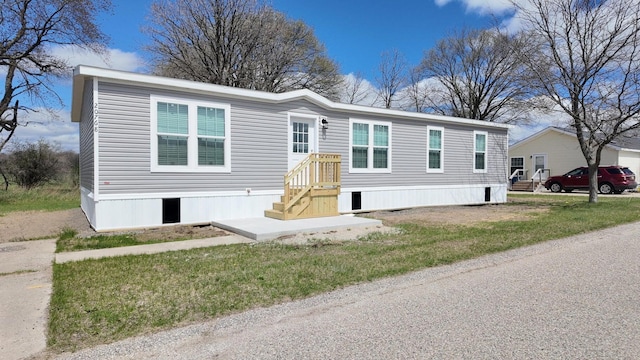 20728 Kalamazoo Rd, Big Rapids, MI 49307 - manufactured / mobile home with a front lawn