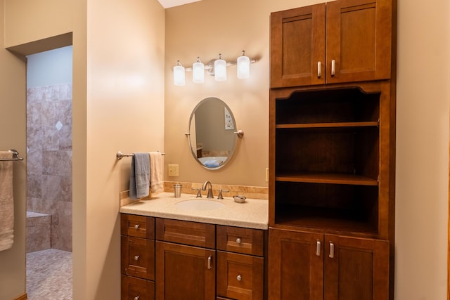 bathroom with walk in shower and vanity