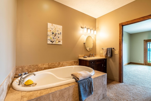 bathroom featuring a bath and vanity