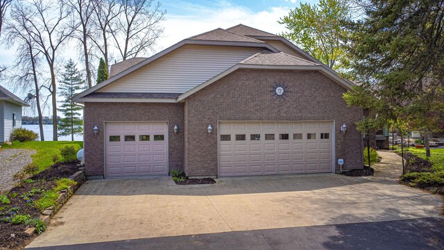 garage featuring driveway