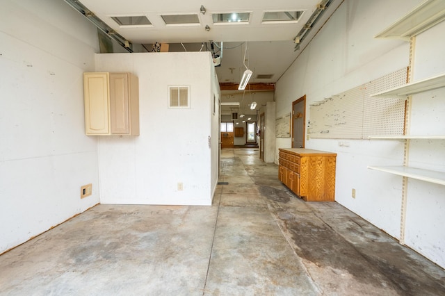 empty room featuring unfinished concrete flooring