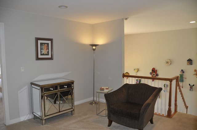 living area with carpet floors and baseboards
