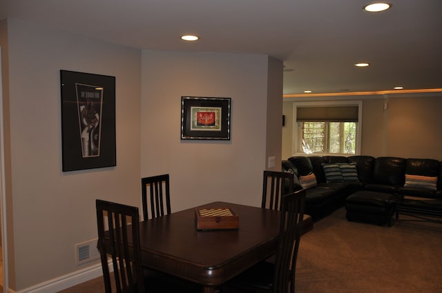 dining room featuring carpet and recessed lighting