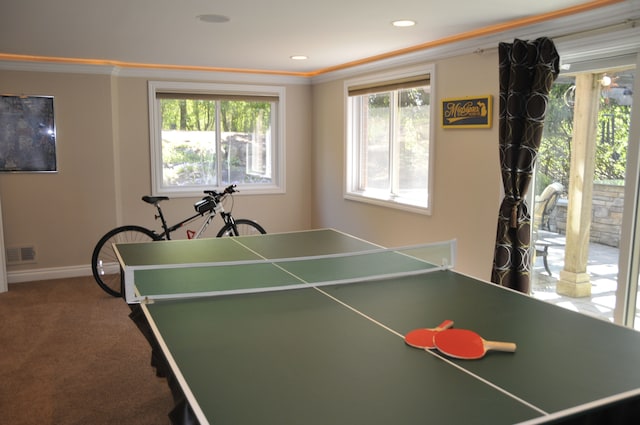 recreation room with healthy amount of natural light, ornamental molding, carpet floors, baseboards, and recessed lighting