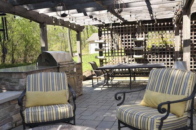 view of patio with a pergola, outdoor dining space, and area for grilling