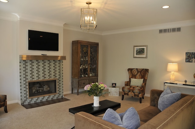 carpeted living area featuring ornamental molding, a chandelier, recessed lighting, a tiled fireplace, and baseboards