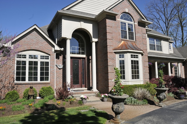 view of front of property featuring brick siding