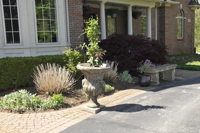view of property exterior with brick siding