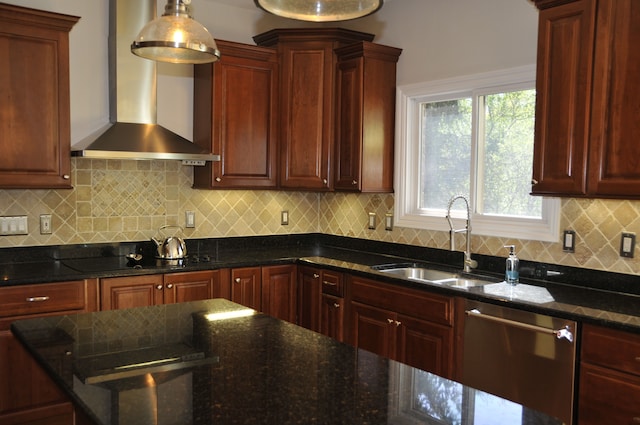 kitchen with wall chimney exhaust hood, dishwasher, a sink, black electric stovetop, and dark stone countertops