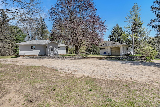 3771 E Loop Rd, Hesperia, MI 49421 - view of yard featuring a detached garage and an outdoor structure