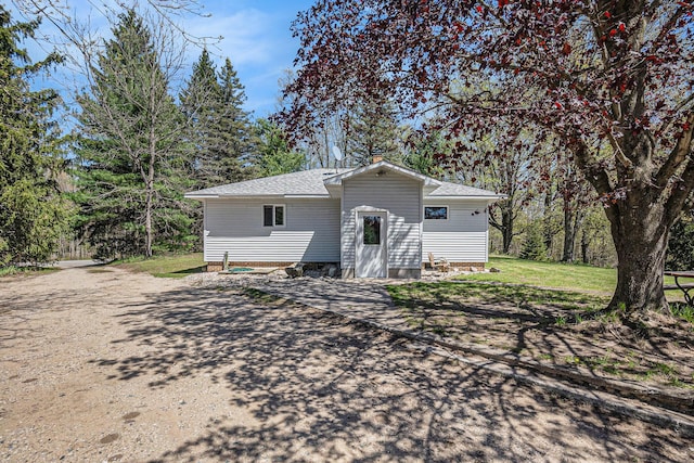 3771 E Loop Rd, Hesperia, MI 49421 - back of house with roof with shingles and a lawn