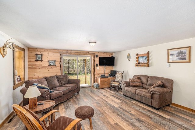 3771 E Loop Rd, Hesperia, MI 49421 - living area with wood finished floors, wooden walls, and baseboards
