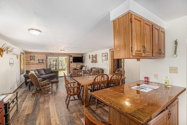 3771 E Loop Rd, Hesperia, MI 49421 - dining space with dark wood-style floors and a textured ceiling