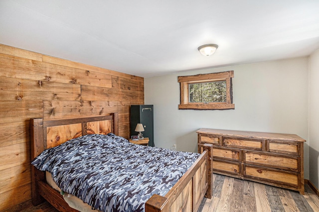 3771 E Loop Rd, Hesperia, MI 49421 - bedroom featuring wood finished floors