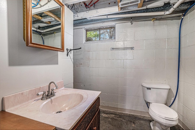 3771 E Loop Rd, Hesperia, MI 49421 - bathroom with toilet, vanity, and concrete flooring