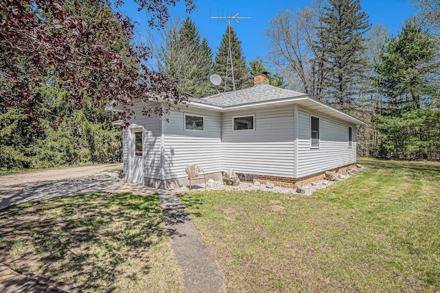 3771 E Loop Rd, Hesperia, MI 49421 - view of home's exterior with a lawn, a chimney, and a shingled roof
