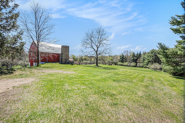 3771 E Loop Rd, Hesperia, MI 49421 - view of green lawn featuring a barn and an outbuilding
