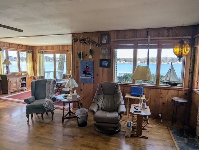 63568 Zabel Shores Rd, Sturgis, MI 49091 - living area with wooden walls, wood finished floors, and a water view