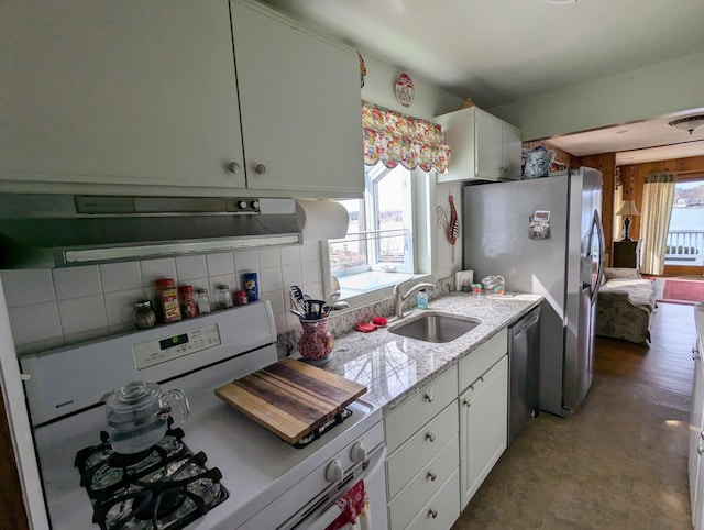 63568 Zabel Shores Rd, Sturgis, MI 49091 - kitchen with appliances with stainless steel finishes, a sink, white cabinetry, and backsplash