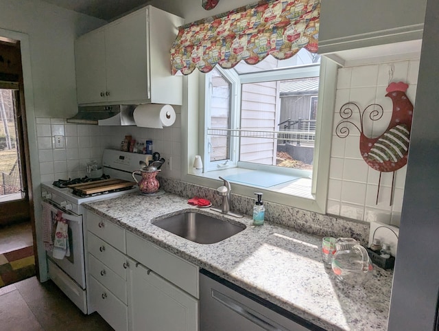 63568 Zabel Shores Rd, Sturgis, MI 49091 - kitchen with white gas range oven, a sink, under cabinet range hood, dishwasher, and backsplash