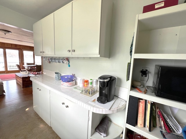 63568 Zabel Shores Rd, Sturgis, MI 49091 - kitchen with tile counters and black microwave