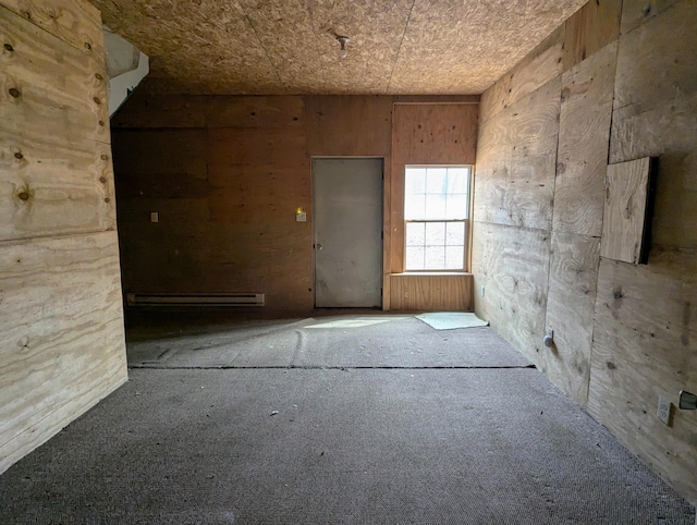 63568 Zabel Shores Rd, Sturgis, MI 49091 - unfurnished room featuring a baseboard heating unit and carpet