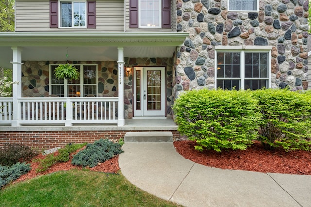 3135 Walnut Hls, Leonard, MI 48367 - property entrance with covered porch and stone siding