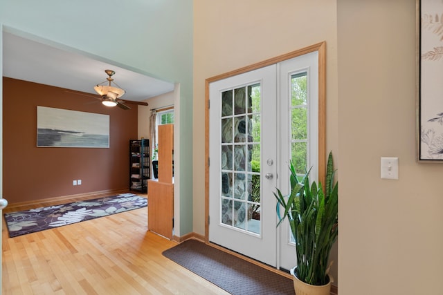 3135 Walnut Hls, Leonard, MI 48367 - doorway to outside featuring wood finished floors, baseboards, and ceiling fan