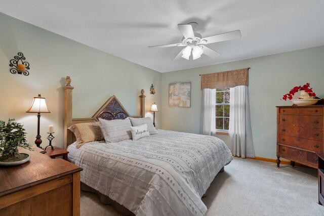 3135 Walnut Hls, Leonard, MI 48367 - bedroom with light carpet, baseboards, and a ceiling fan