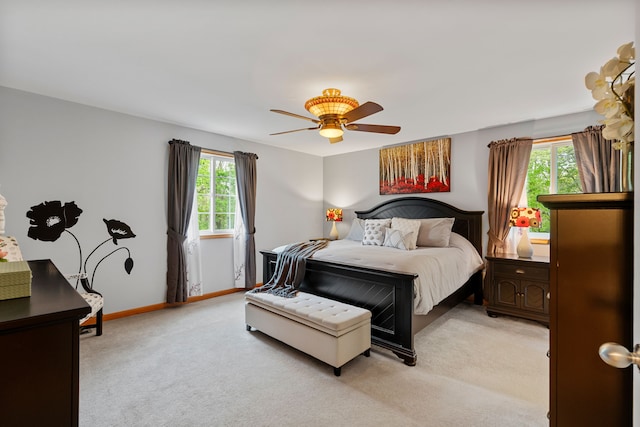 3135 Walnut Hls, Leonard, MI 48367 - bedroom featuring light carpet, ceiling fan, and baseboards