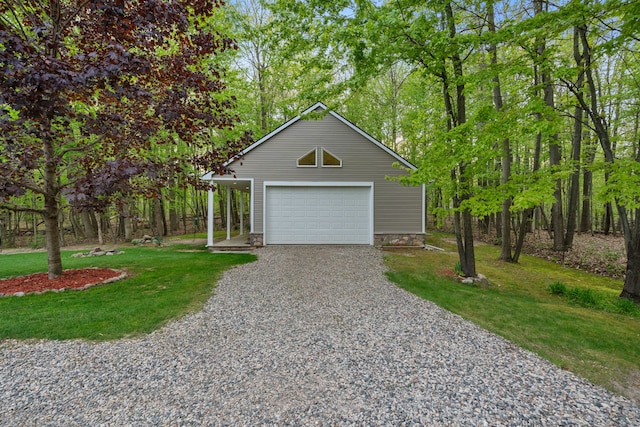 3135 Walnut Hls, Leonard, MI 48367 - view of front facade featuring a front lawn, gravel driveway, and a detached garage