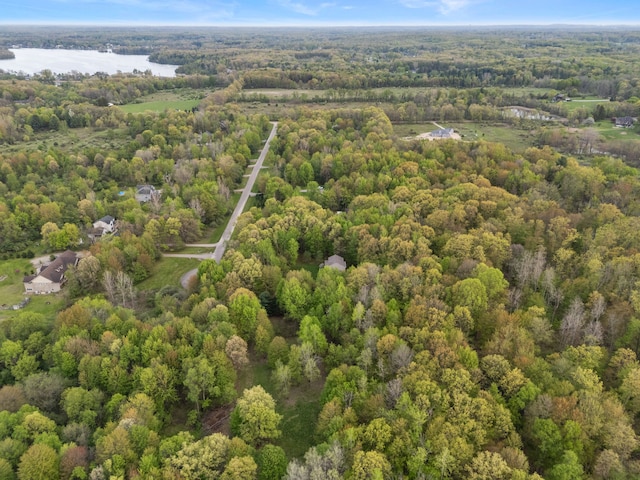 3135 Walnut Hls, Leonard, MI 48367 - aerial view of property and surrounding area featuring a forest and a nearby body of water