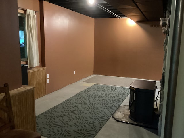 3135 Walnut Hls, Leonard, MI 48367 - finished below grade area with a wood stove