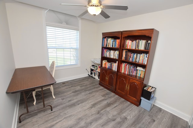 9466 Heritage, Goodrich, MI 48438 - office area featuring wood finished floors, ceiling fan, and baseboards