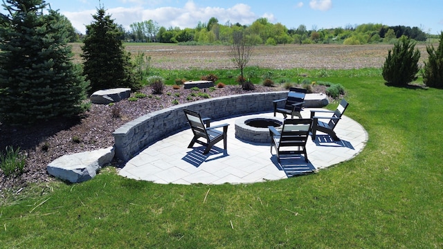 9466 Heritage, Goodrich, MI 48438 - view of grassy yard with a fire pit and a patio area