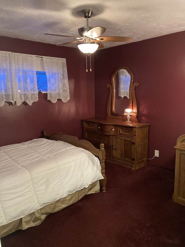 1548 Sunterra Trl, Boyne City, MI 49712 - bedroom featuring carpet floors, a ceiling fan, and a textured ceiling
