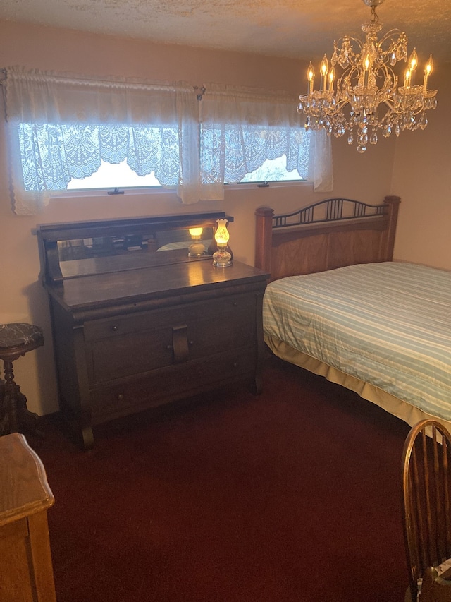 1548 Sunterra Trl, Boyne City, MI 49712 - carpeted bedroom with a chandelier