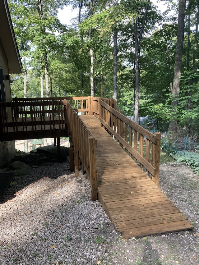 1548 Sunterra Trl, Boyne City, MI 49712 - wooden terrace featuring view of scattered trees