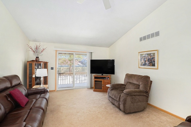 9098 Luea Ln, Swartz Creek, MI 48473 - living area featuring light carpet, lofted ceiling, ceiling fan, and baseboards