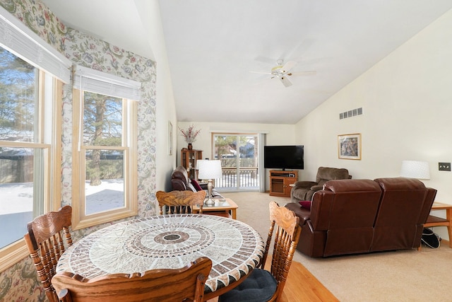 9098 Luea Ln, Swartz Creek, MI 48473 - dining area with light carpet, vaulted ceiling, and ceiling fan