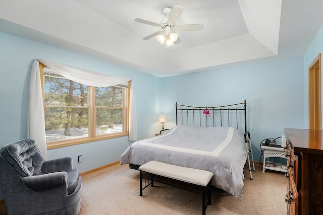 9098 Luea Ln, Swartz Creek, MI 48473 - bedroom featuring light carpet, baseboards, a raised ceiling, and ceiling fan