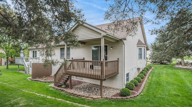 9098 Luea Ln, Swartz Creek, MI 48473 - rear view of house featuring stairway, a deck, a lawn, and roof with shingles